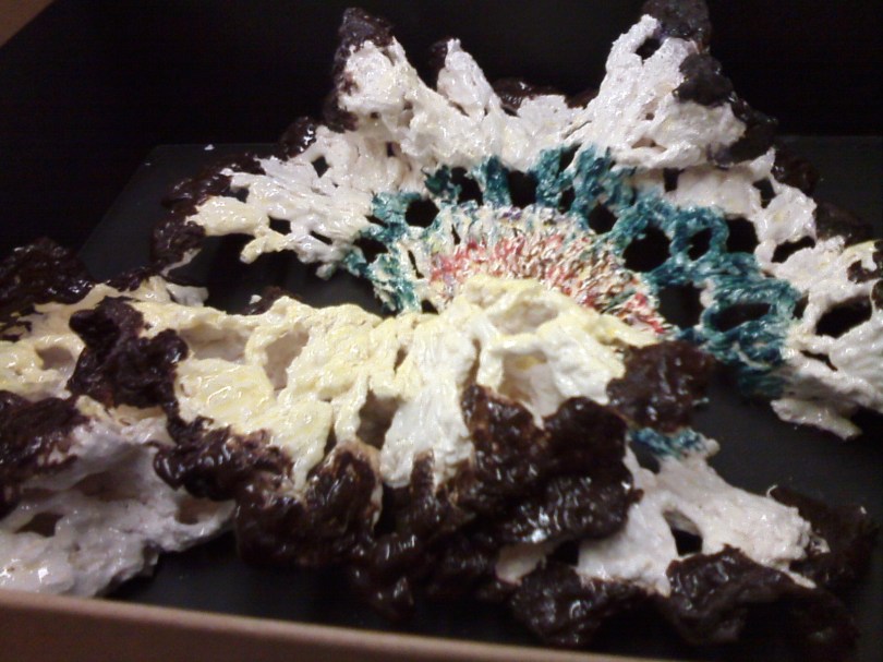 coloured doily, brown and blue